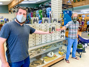 Jonathan and Daniel barton in Pacific outfitters holding binoculars