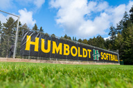 chain link fence with Humboldt Softball sign