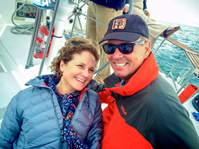 Kathy and John Ballard smiling for the camera on a boat